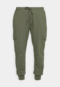 Pantaloni della tuta verde oliva realizzati in un tessuto morbido, con vita elasticizzata e coulisse, polsini affusolati e tasche cargo laterali.
