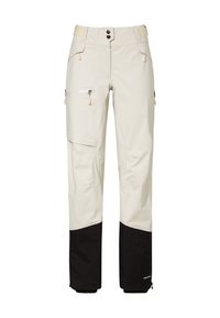 Hellbeige Outdoorhose mit schwarzem Verstärkungsstoff an den Unterschenkeln, Reißverschlusstaschen und verstellbaren Klettverschlusstaschen am Bund.