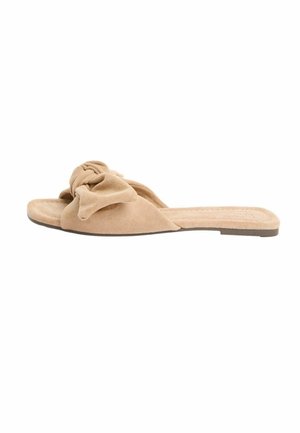 Beige suede flat slide sandal with a soft knotted bow detail on top and a flat sole.