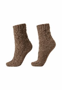 Braune gestrickte Socken mit einem strukturierten Zopfmuster, ausgestattet mit einem gerippten Bündchen und einem weichen, gemütlichen Material für Wärme und Komfort.