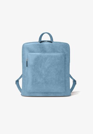 Light blue faux leather backpack with a smooth texture, square shape, front zip pocket, and adjustable straps. Top handle for easy carrying.