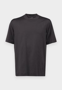 Black short-sleeve T-shirt made of smooth fabric. Features a crew neckline and embossed text detail along the right side.