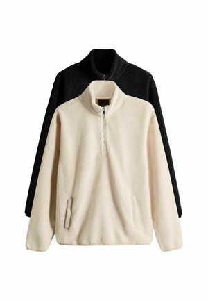 Kaksi fleece-hupparia esillä: yksi vaaleanruskea neljänneksentyönnöllä varustettu kaulus ja sivutaskut, ja toinen musta. Pehmeä tekstuuri, rento malli.