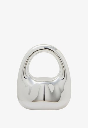 Fényes ezüst fém vázát a lekerekített, absztrakt forma és a középső fogantyú jellemzi. Simább textúrájú, tükröződő felülettel rendelkezik, és nincs további díszítés rajta.