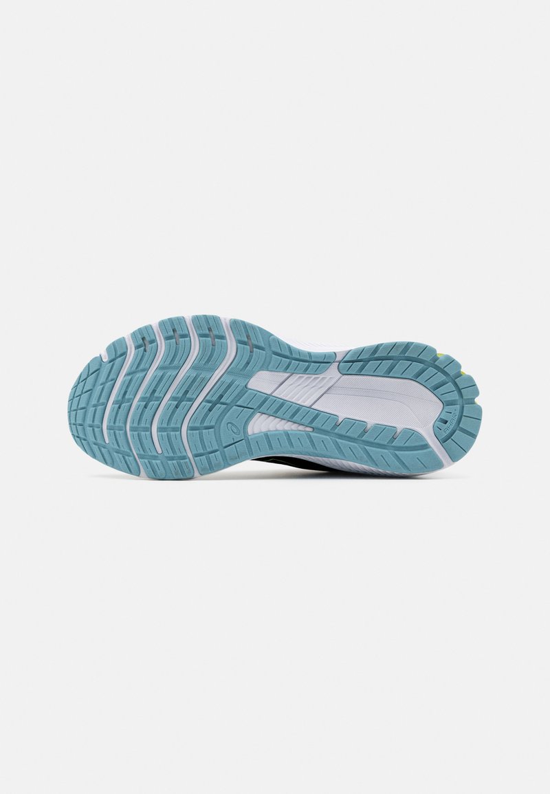 Suela de zapato con una suela de goma ligera azul texturizada, que presenta surcos y crestas para ofrecer tracción; contrastada por elementos blancos y grises.