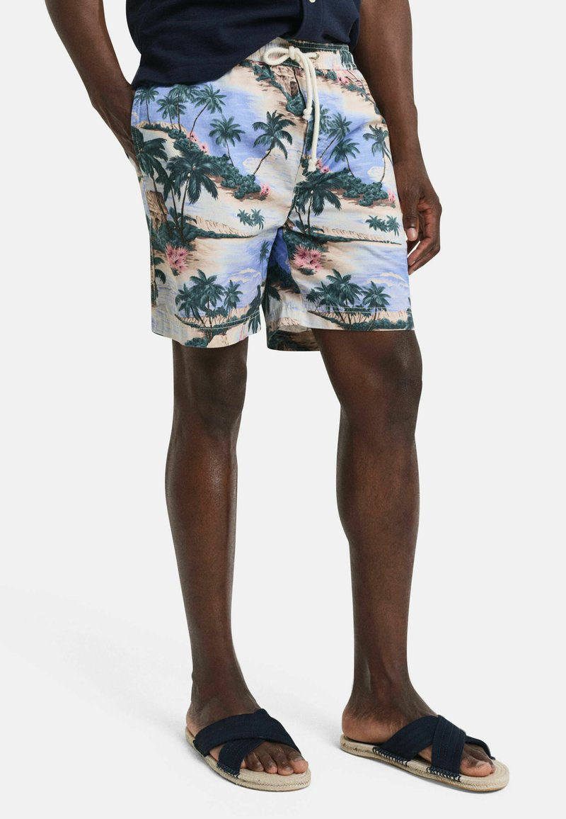 Zwemshorts met een tropisch patroon van palmbomen in blauw, beige en groen. Gemaakt van lichtgewicht stof met een elastische tailleband.
