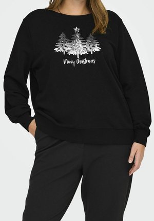 Sudadera negra con árboles de Navidad de lentejuelas plateadas y estrella, texto "Feliz Navidad", combinada con pantalones negros a juego.