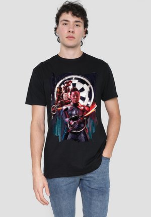 Black cotton t-shirt featuring a graphic print of stylized characters in front of a circular emblem, with vibrant colors and detailed accents.