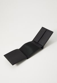 Black fabric wallet with a textured exterior, three card slots on one side, and a smooth interior compartment. Folded design, no visible hardware.