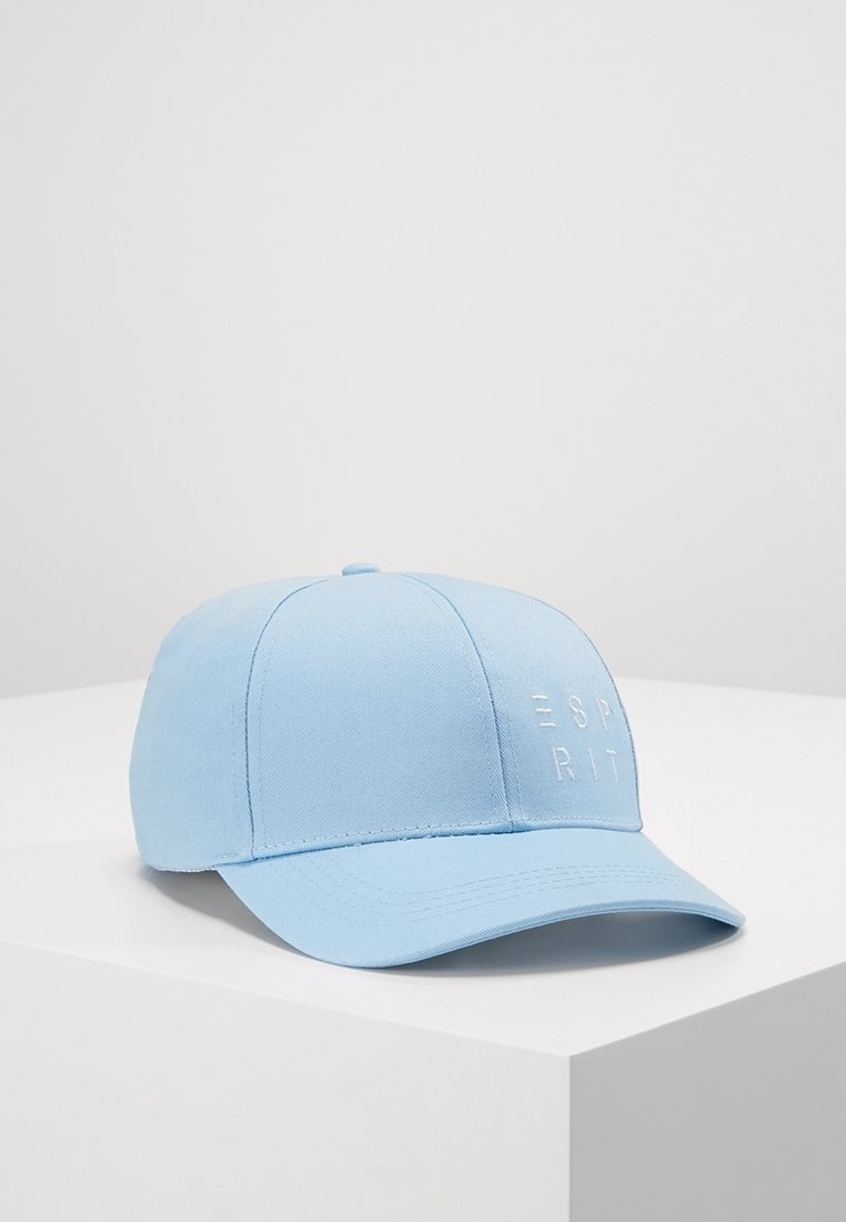 Casquette de baseball bleu clair avec logo ESPRIT brodé en blanc sur le devant, placée sur une surface blanche sur un fond gris clair uni.