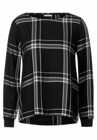 Blusa a maniche lunghe a scacchi bianco e nero con scollatura rotonda e polsini elasticizzati. Tessuto morbido con vestibilità comoda e orlo curvo.