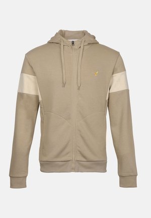 Beige zip-up hoodie with drawstrings, ribbed cuffs, light beige stripes on upper sleeves, and small yellow bird logo on the chest.