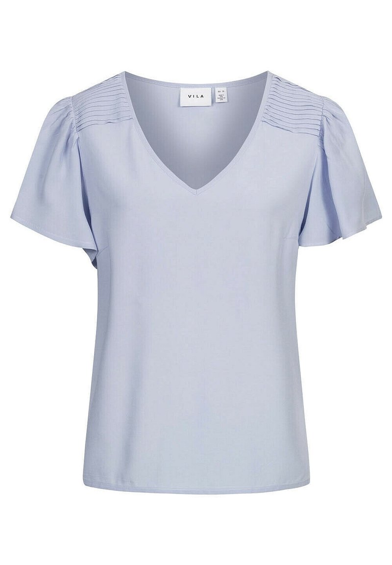 Ljusblå V-ringad blus med korta, puffade ärmar, som har sammanknopad textur på axlarna. Tillverkad av ett mjukt, lätt tyg.