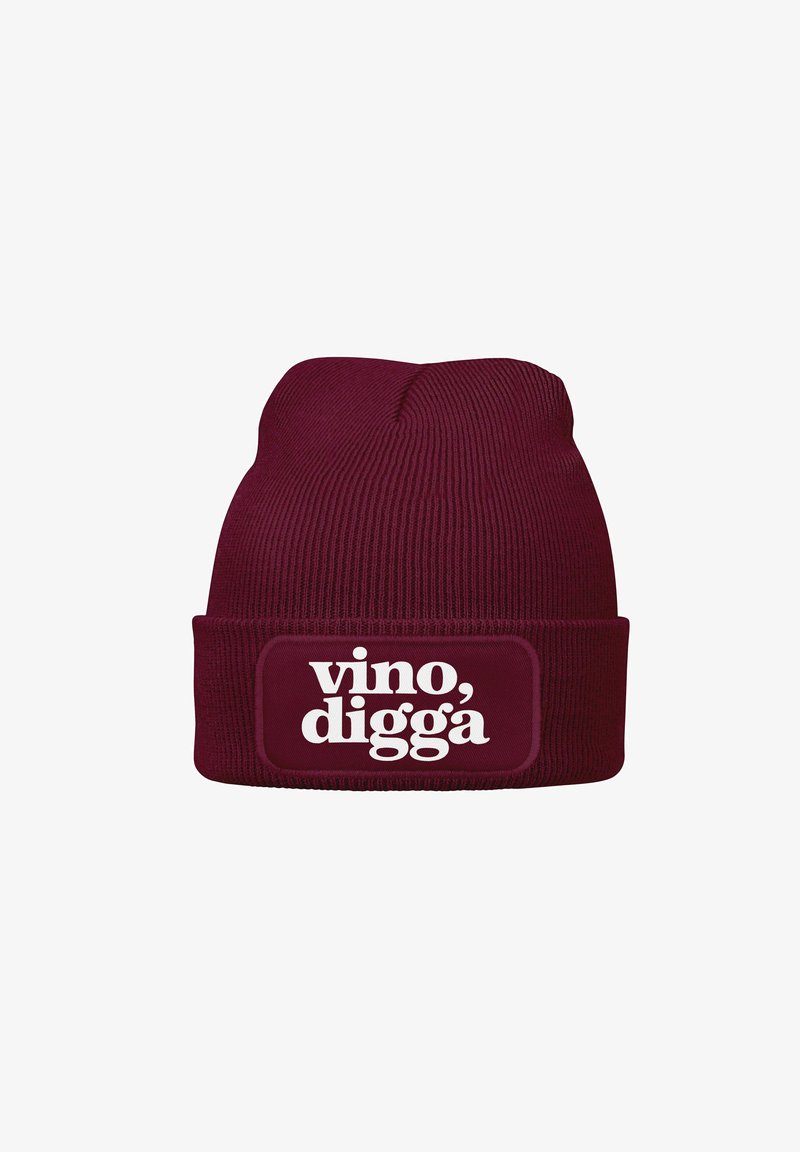Burgundy knit beanie with folded cuff, featuring a white printed label that reads "vino, digga." Ribbed texture throughout.