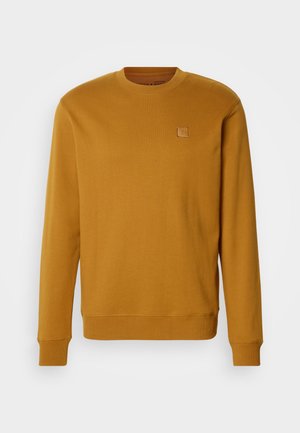 Senfgelbes Sweatshirt aus weichem Stoff, mit Rundhalsausschnitt, gerippten Bündchen und einem kleinen quadratischen Logo-Patch auf der Brust.