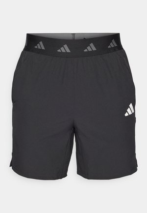 Shorts sportivi neri realizzati in tessuto leggero. Presentano una cintura elastica con un logo a motivi e un piccolo logo bianco sul lato sinistro.