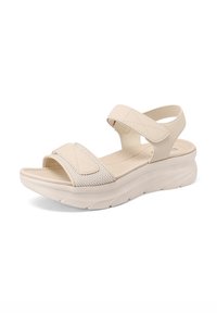 Sandalo beige con cinghie di tessuto regolabili, dettagli in rete testurizzata, soletta imbottita e una suola spessa, leggermente piattaformata.