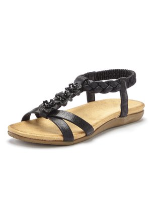 Schwarze Sandale mit geflochtenem Riemendesign und Blumenakzent. Verfügt über eine gepolsterte, braune Innensohle und einen elastischen hinteren Riemen für zusätzlichen Komfort.