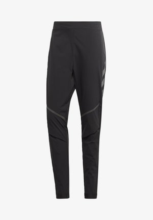 Zwarte taps toelopende sportbroek met een hoge tailleband en reflecterende diagonale strepen op de dijen en knieën, ontworpen voor hardlopen of sport.