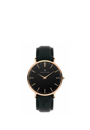 Montre-bracelet à cadran noir avec boîtier doré, marqueurs d'heure dorés minimalistes, aiguilles et bracelet en cuir noir indiquant l'heure 9:11.