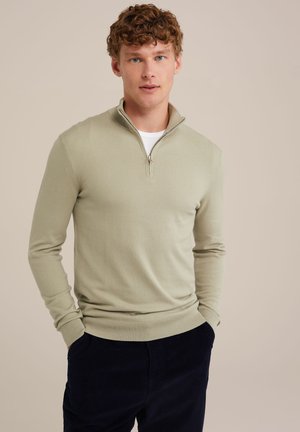Sudadera verde claro con cremallera y mangas largas, con puños de canalé. Cuenta con una cremallera de longitud cuartilla y una textura suave y lisa.
