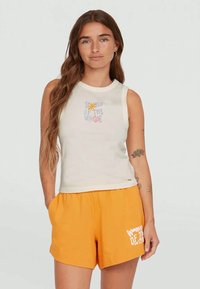 Light beige sleeveless top with colorful "Waves" graphic, paired with bright orange shorts featuring white text and an elastic waistband.