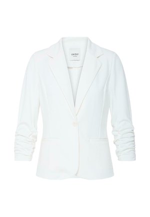 Valge naiste kohandatud bleiser rüütud varrukate, ühe eesnupu, sälk-lapelide ja kahe eesmise taskuga.