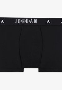 Črne bokserice so izdelane iz mehkega blaga z gladko strukturo, imajo elastičen pas z napisom "JORDAN" v beli barvi in funkcionalno sprednjo žep.