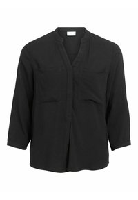 Blusa nera senza bottoni con scollatura a V, due tasche sul petto e maniche lunghe. Realizzata in tessuto leggero con una texture liscia.