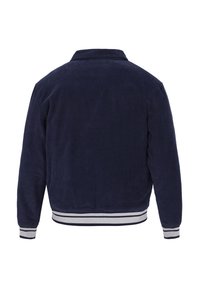 Mørkeblå kordfløjljakke med ribbet tekstur, der har krave og stribede elastiske manchetter og kant. Bagview præsenteret.