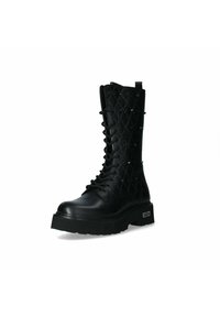 Stivaletto alla caviglia in pelle nera con allacciatura, al shaft decorato, suola piatta e testurizzata, e dettagli lucidi sui lati. Presenta un'asola sul retro.