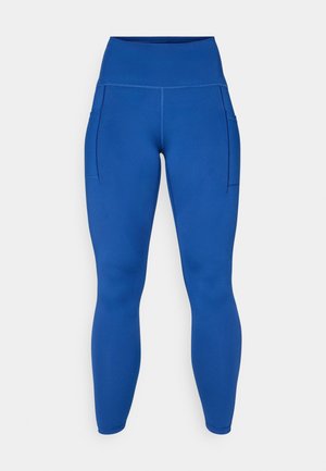Blauwe leggings met hoge taille van een soepel, rekbaar materiaal, voorzien van zijzakken en platte naden voor extra comfort en stijl.