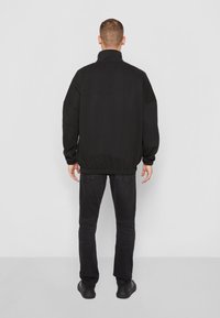 Calvin Klein Jeans BOLD LOGO COLORBLOCK ZIP UNISEX - Sweatshirt - black