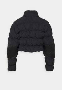 Black cropped puffer jacket with high collar and quilted design, featuring reinforced darker elbow patches on long sleeves.