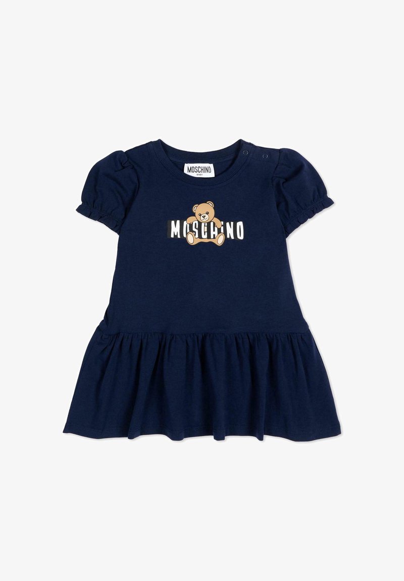 Robe bébé bleu marine avec manches courtes bouffantes, jupe froncée et motif d'ourson accompagné du texte "Moschino" sur la poitrine.