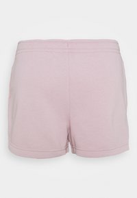 Pink cotton shorts with a smooth texture, elastic waistband, and double-stitched seams. Features side pockets and a simple design.