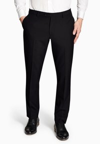 Pantalones negros ajustados con un frente plano, que cuentan con dos bolsillos laterales y un cierre de botón. Tejido suave y tejido con un acabado limpio.