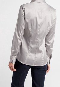 Light grey satin shirt, fitted design with a pointed collar, long sleeves, and button cuffs. Smooth texture with no visible patterns.