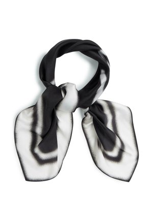 Mustvalge siidist sall abstraktse gradientmustriga, stiilitud lahtise sõlmena.