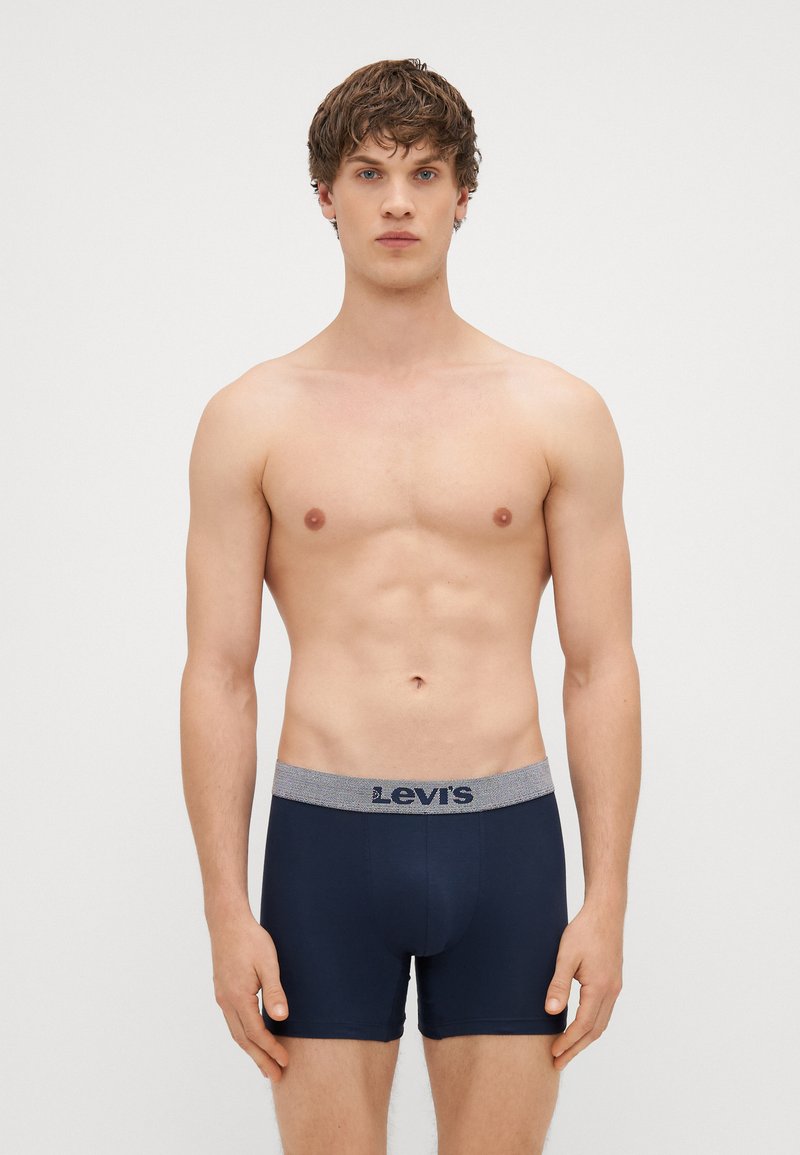 Navy blue boxer briefs made from a soft fabric, featuring a contrast elastic waistband with "Levi's" logo and a snug, fitted design.