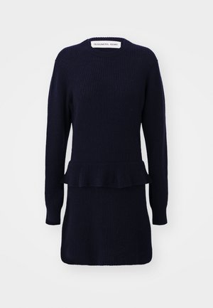 Robe en tricot bleu marine avec des manches longues, texture côtelée, un détail peplum à la taille et un col rond.