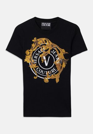 Black short-sleeve Versace Jeans Couture t-shirt with gold baroque design and white circular logo centered on the front.