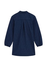 Tunika blu navy con maniche lunghe e gonfiate, caratterizzata da un motivo bianco a spirale. Il retro include una piega per maggiore libertà di movimento.