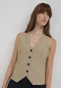Calliope Smanicato - beige