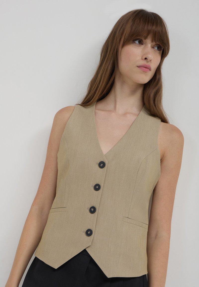 Calliope Smanicato - beige
