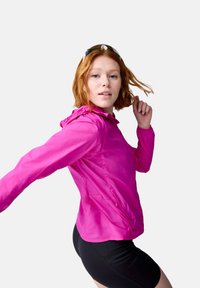 Lightweight, bright pink jacket with a hood, featuring a zippered front and elastic cuffs. Smooth texture, fitted design, and side pockets.