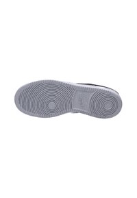 Rubber shoe sole with concentric circular tread pattern. Predominantly gray with slight texture and branding detail at the heel area.