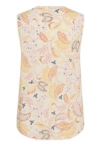 Haut sans manches avec un fond crème présentant un motif floral en rose, jaune et bleu marine, fabriqué en matériau doux et léger.