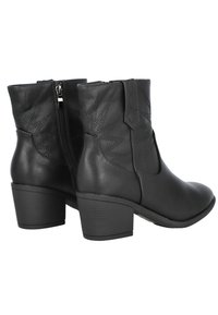 Botines de cuero negro hasta el tobillo con punta redondeada, cremallera lateral y un diseño de costura en contraste en el caña. Diseño de tacón cuadrado bajo.