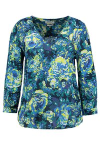 Blumenbluse mit tiefem V-Ausschnitt, langen Ärmeln und einem marineblauen Hintergrund, der große gelbe und blaue Rosenmuster zeigt. Glatter Stofftextur.